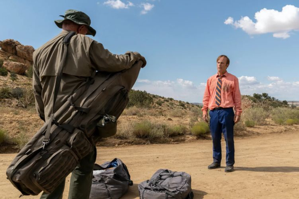 Image from Better Call Saul: Saul, Mike and the duffel bags in the desert.