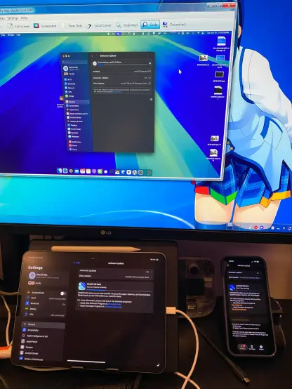 Photo showing Mac/iPad and a watch being upgraded to beta version 26