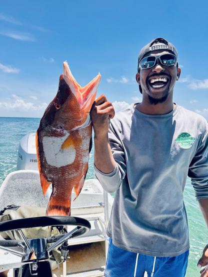 Our snorkle guid holds up the Hogfish he speared.