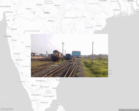 A photo of or from a train station from the linked website, overlaid on a cropped world map where it's located.