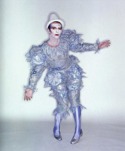 David Bowie wearing his silvery blue Pierrot the clown outfit. Striking and elegant.
