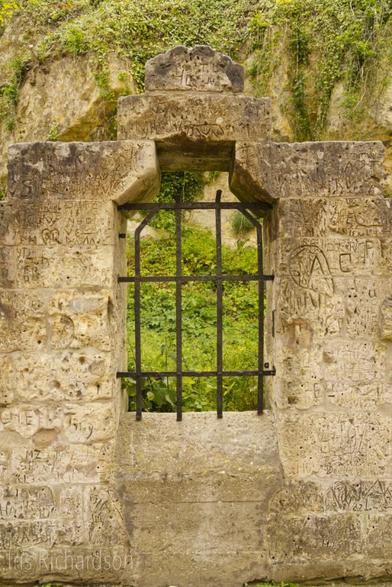 Castle ruin window with graffiti