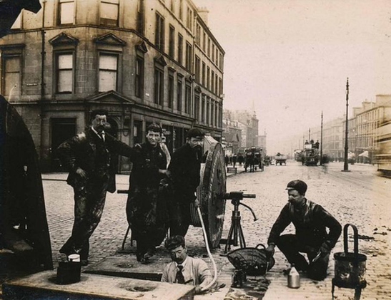 Workers lay the electric cables in the passageway at the top of McDonald Road towards the city centre