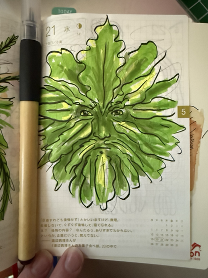 Sketchbook page featuring drawing of a green man