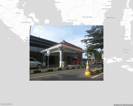 A photo of or from a train station from the linked website, overlaid on a cropped world map where it's located.