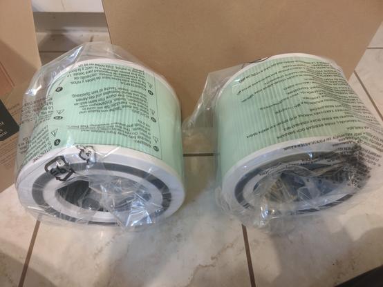 2 identical teal coloured air filters. Left is OEM & right is off-brand.