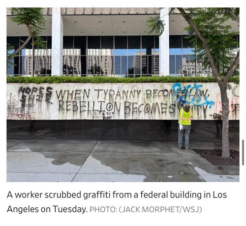 A worker wearing a safety vest cleans graffiti from the side of a federal building in Los Angeles. The wall features various messages and artwork, including the phrase, “When tyranny becomes law, rebellion becomes duty.”

Image caption: A worker scrubbed graffiti from a federal building in Los Angeles on Tuesday. PHOTO: (JACK MORPHET/WSJ)

https://www.wsj.com/us-news/l-a-spends-another-night-on-edge-as-trump-sends-in-marines-a7c6780a

Accessed: 10 June 2025 at 1923 MST