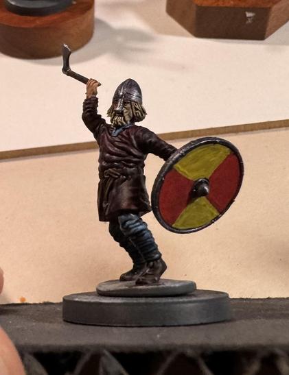 A 28mm Viking with a roundshield in his hand. It's quartered red and yellow.