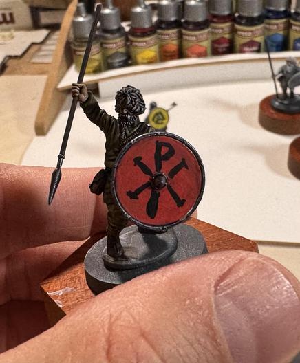 A 28mm Viking (really, an Irish thrall) with a roundshield. It's red with a black chi-rho on it.
