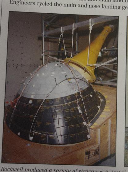 Space shuttle nose with a big horn pointed at it for acoustic testing