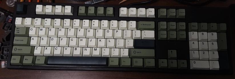 Large mechanical keyboard with new key caps.

The letter and number keys are a very pale (almost white) green color with highly legible characters on them.

The others are various darker shades of green. The set was called something like "green tea".

No fancy Blender / Audacity / Ardour symbols and no Cyrillic and Greek -- but truth be told, I never used them anyway.
