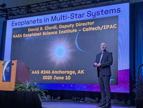 David Ciardi stands on stage in front of a giant screen with slides.
Exoplanets in Multi-Star Systems
David Ciardi, Deputy Director, NASA Exoplanet Science Institute — Caltech/IPAC
AAS #246 Anchorage, AK 2025 June 10