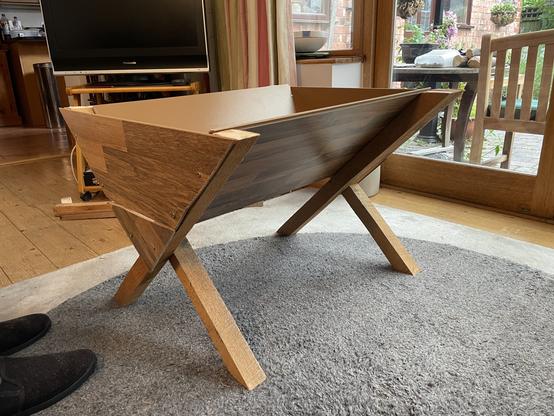 a 70cm wide raised trough looking rather like a manger, with x-shaped legs