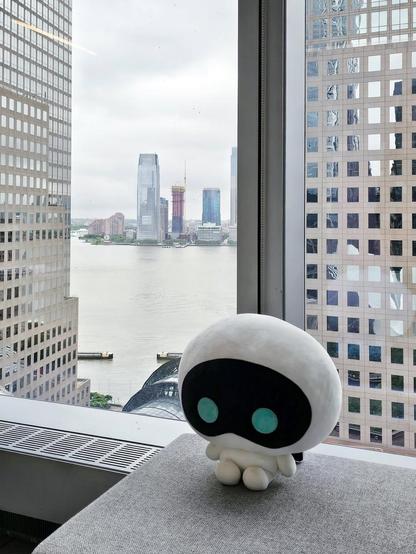 Wootteo in a tall building, looking out to the river