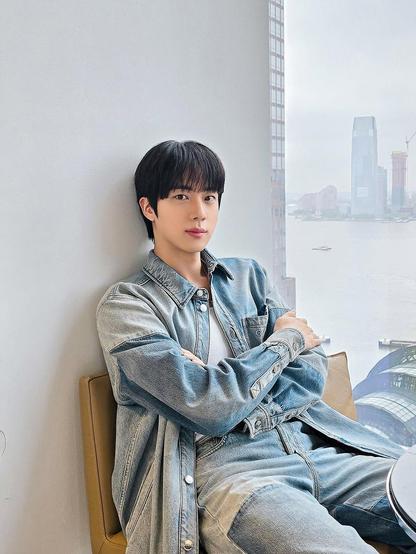 Jin posing in denim with a riverview behind him - Wootteo's Insta Feed
