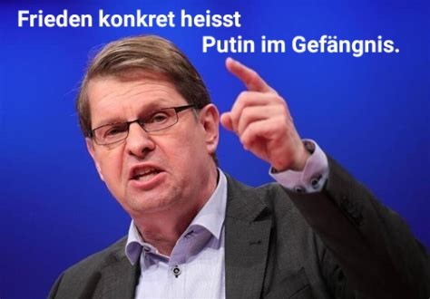 Stegner, erhobener Zeigefinger, spruch: Frieden konkret heisst Putin im Gefängnis.