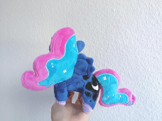 side view of a small plush of Luna from mlp
