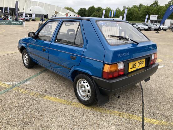 Blue Skoda Favorit, rear quarter view