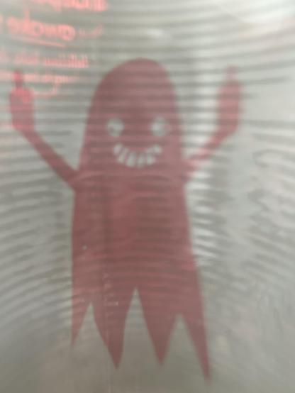 ein rotes grinsendes Gespenst mit zwei erhobenen Mittelfingern.