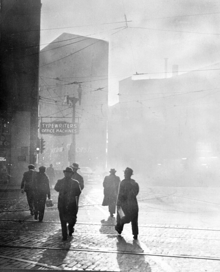 Photo shows the smoke covered corner of Liberty and Fifth Avenues in Pittsburgh. Image courtesy of the Smoke Control Lantern Slide Collection, c.1940–1950, AIS.1978.22, Archives & Special Collections, University of Pittsburgh Library System.
