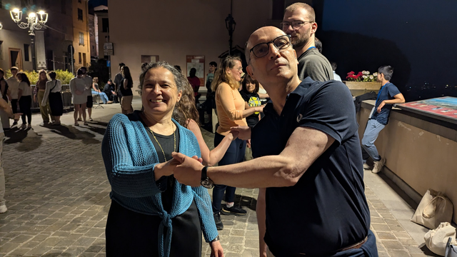 Enrico Motta together with Natasha Noy, dancing on the nightly village sqaure in Bertinoro