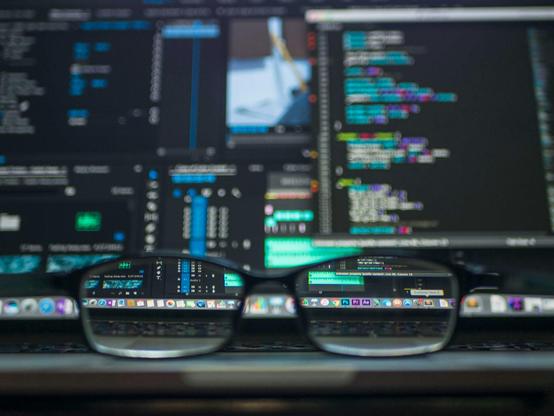 Data codes through eyeglasses. Photo by Kevin Ku on Pexels.com