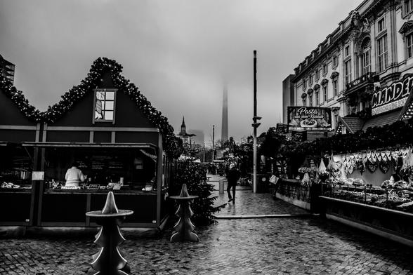 A Christmas market with the Berlin TV tower in the background.