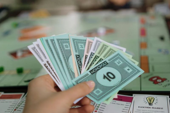 Image of Monopoly money by Berna via Pexels