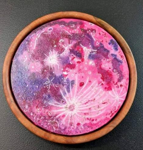 Strawberry Moon in a circular wooden frame.