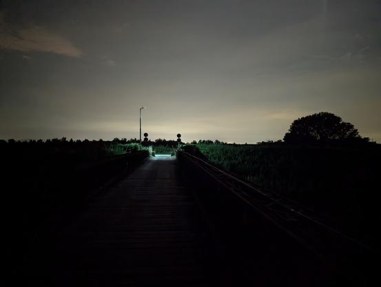 A night shot of an old Bailey Bridge over the Reno River, Bologna, Italy