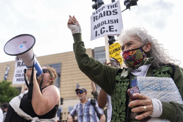 Demonstrators protest ongoing raids by Immigration and Customs Enforcement officers, Tuesday, June 10, 2025, in Washington. (AP Photo/Julia Demaree Nikhinson)