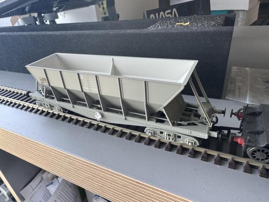 A single Accurascale ICI hopper wagon. It sits on two small bogies and has tension lock couplings that are in shorter than standard NEM pockets.