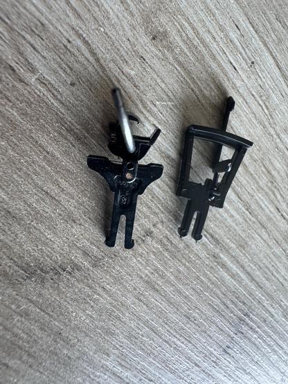 A KaDee NEM coupling next to a tension lock coupling from the Accurascale wagon, showing that the standard NEM pocket is longer than that on the model