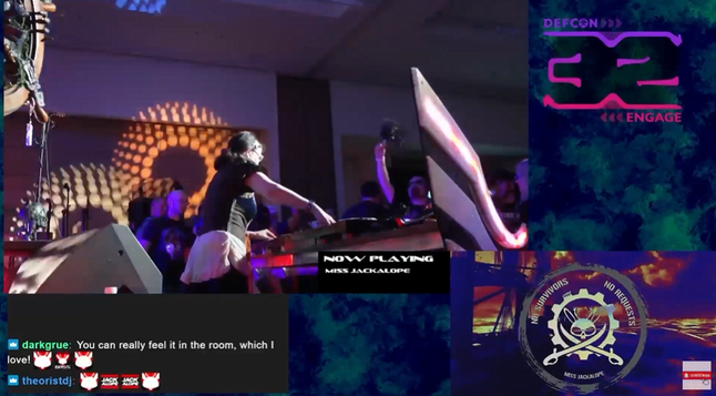 Hi! Screenshot of Miss Jackalope Djing at defcon 32 with a sort of crowd shot.