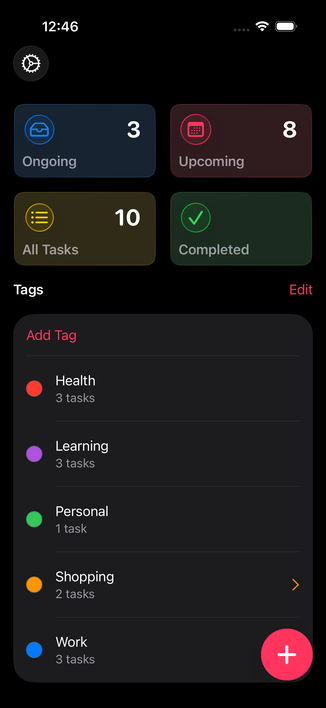 The TaskFrame Dashboard with the new Liquid Glass button in dark mode.