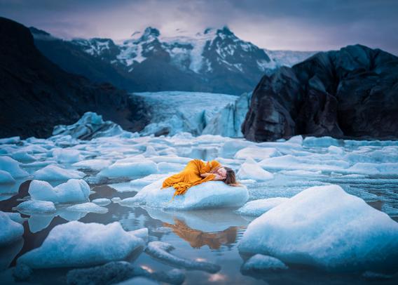 8/100 from my self portrait project.

Probably my personal favourite and most meaningful image (to me) so far this year.

The title/words rang true in my head while spending a few days at this glacier in Iceland, noticing the vast difference in the last 9 years, nevermind just the last week spent there watching sections of ice the size of apartment buildings calving off from the glacier, breaking into thousands of icebergs that will never be part of that mountainside again. It was all at once wild and heartbreaking to see, and filled me with the realization of the raw truth… for some of these special places, very soon, there will be nothing left but stories. 💙

I wanted to create something to remember and document these thoughts, to portray a connection to our Mother Earth, to hold on tight and remember her and protect her. Because now more than ever, we need to be her mother, too. 💙

P.S. This iceberg was safely grounded on the shore for this 4am shoot - I just had to walk through freezing knee deep water to reach it.