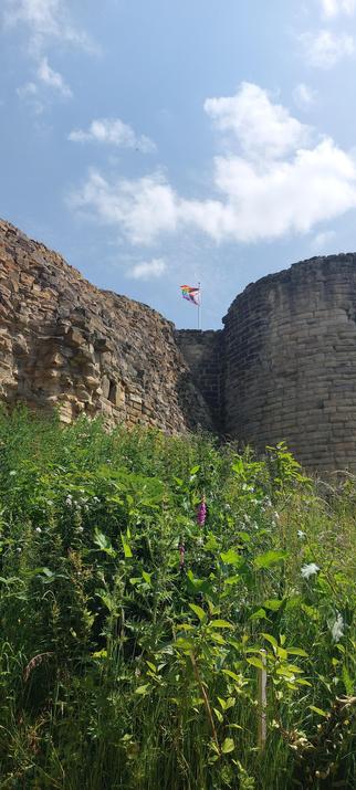 Pontefract Castle walls with Pride flag