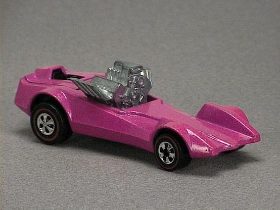 Released in 1973, Fluorescent Pink Strip Teaser of 1973 Shell Promos with Redline wheels. Notes: Driver's compartment has a flip-up lid. Packaging: Polybag w/dark blue cardboard top w/Shell logo. Metal Body, Metal Base. Made in Hong Kong. Scarcity: 7/10
