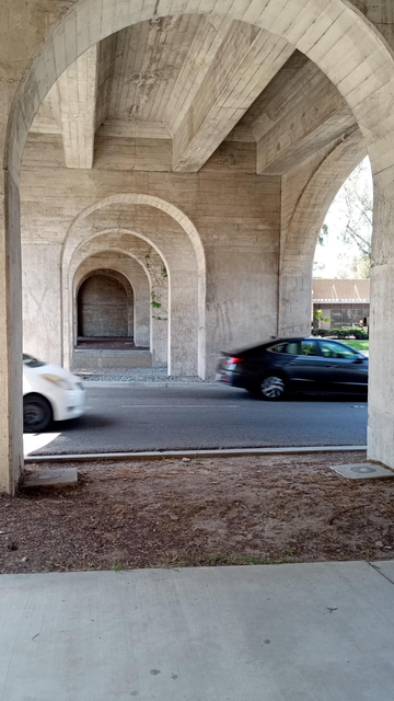 the row of arches under the bridge