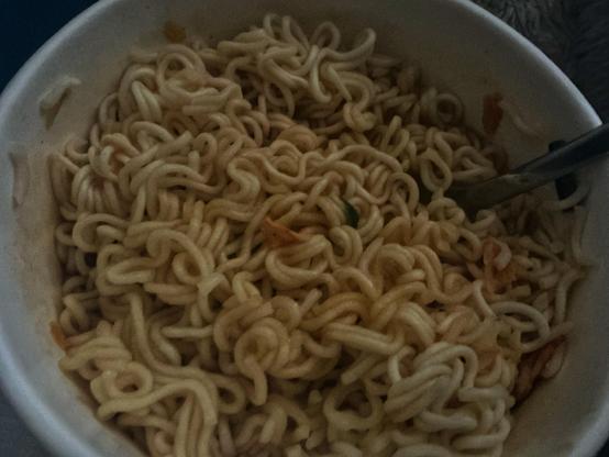 A blurry, low light photo of my Kimchi noodles.