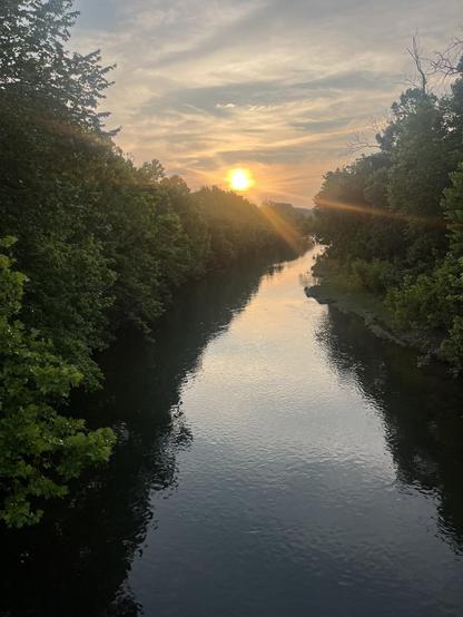 Sun setting above trees along the nanksofva river