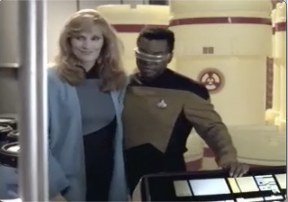 Crusher and LaForge prepare to evacuate the cargo bay of all oxygen. Dr. Crusher is really happy about it.