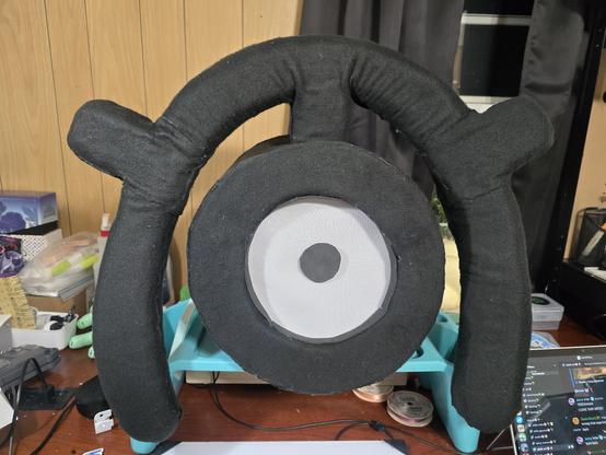 an unown fursuit head of the letter m