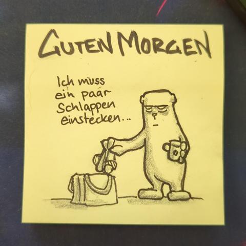 Auf einer gelben Haftnotiz steht "guten morgen" 
Darunter ist der officebear zu sehen der in einer Hand eine Kaffeetasse hat und mit der anderen ein Paar Schlappen über eine Tasche hält. Er kommentiert das mit "ich muss ein paar Schlappen einstecken..."