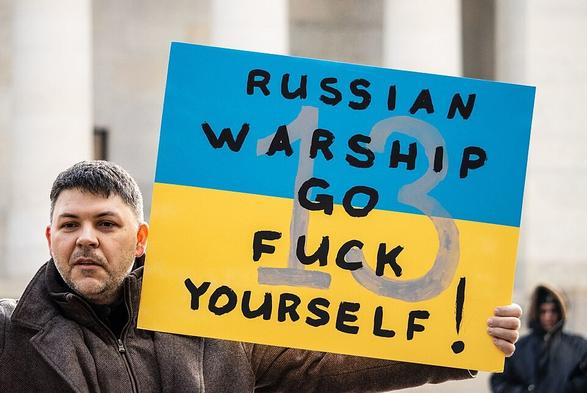 Protester carrying a sign with a slogan at rally in support of Ukraine, outside the Ohio Statehouse in Columbus, Ohio, United States, 26 February 2022.