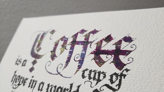 Angled shot showing the red sheen and gold shimmer in the 'coffee' ink