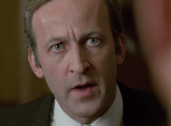ChatGPT describes the image as "The image captures a close-up of a middle-aged man with a serious, intense expression, suggesting a moment of confrontation or revelation. His slightly parted lips and focused eyes convey urgency or disbelief. Dressed formally in a suit and tie, the setting appears to be indoors, possibly an office or institutional environment, indicated by the blurred background with warm tones. This scene likely involves a tense dialogue or an unfolding critical plot point, reflecting themes of political intrigue, personal loss, or uncovering dark secrets within a complex narrative. The character’s emotion and attire emphasize his involvement in urgent and weighty matters."

BotOfDarkness, version 2.0.23.