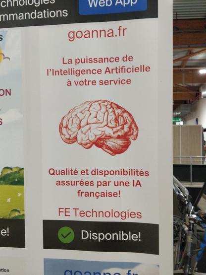 Kakémono présentant goanna.fr de FE Technologies. De part et d’autre d’une illustration de cerveau, on peut lire « La puissance de l’Intelligence Artificielle à votre service » et « Qualité et disponibilité assurés par une IA française ! ».