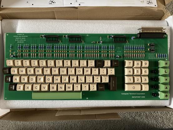 Top view of the keyboard. The main keys are a delicate creamy yellow. Special keys are a rich chocolateybrown with light minty green legends. Space bar and system keys are the same shade of mint.
