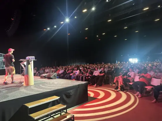 View from behind the stage over the audience.
